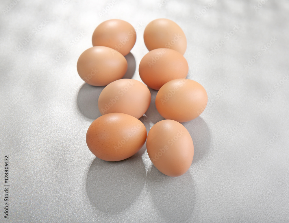 Raw eggs on grey background Raw eggs on grey background