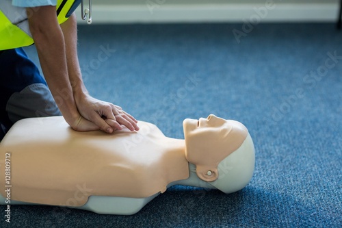 Female paramedic during cardiopulmonary resuscitation training photo