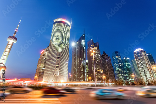 Photography night view of modern buildings and city road in shanghai