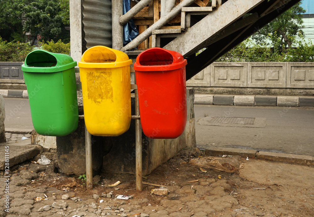 group of colourfull trash box in side street group of colourfull trash box in side street