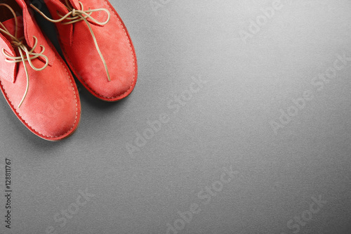 Red shoes on grey background