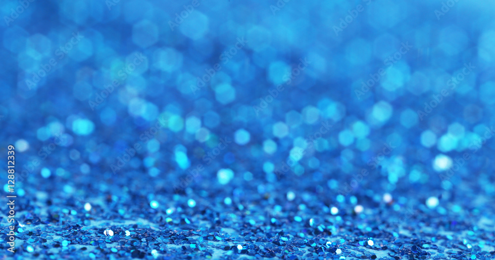 Defocused blue glitter background