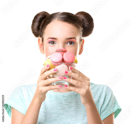 Cute girl with macaroons on...