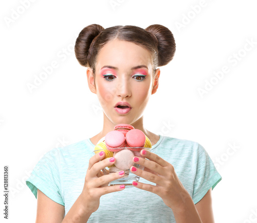 Cute girl with macaroons on...