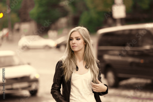 Beautiful young woman walki...