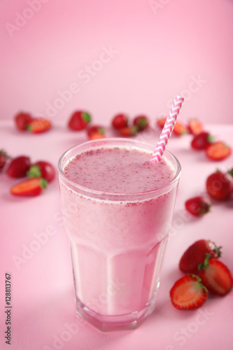 Berry milkshake on color background