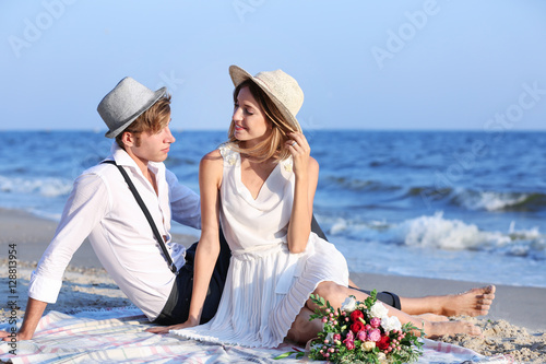 Young happy couple sitting ...