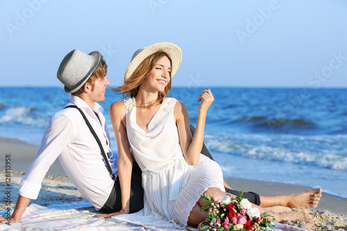 Young happy couple sitting ...