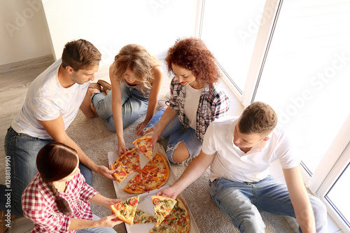 Friends having fun and eati...
