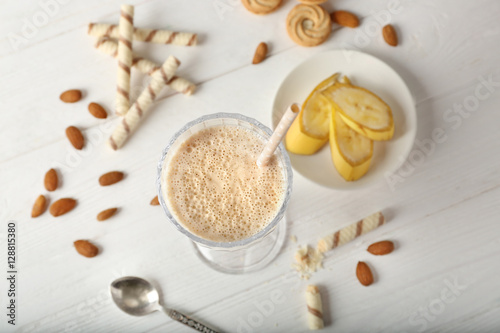 Fresh banana cocktail on wooden background