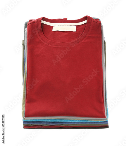 Stack of colorful t-shirts on white background