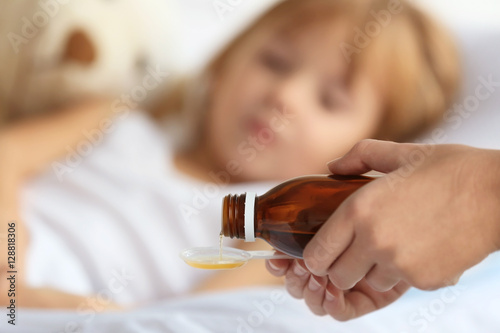 Woman pouring syrup for sic...
