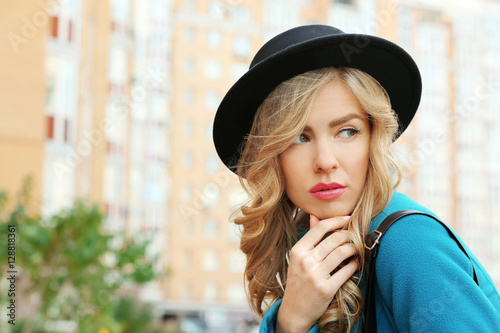Young stylish woman walking...