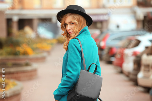 Young stylish woman walking...