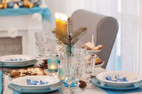 Table served for Hanukkah in living room  closeup