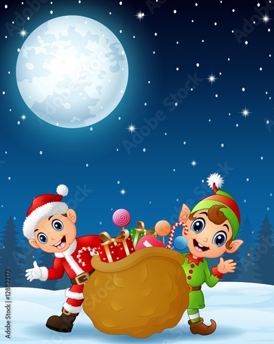Santa claus kid with cartoon elf and a sack full of gifts in the winter night background