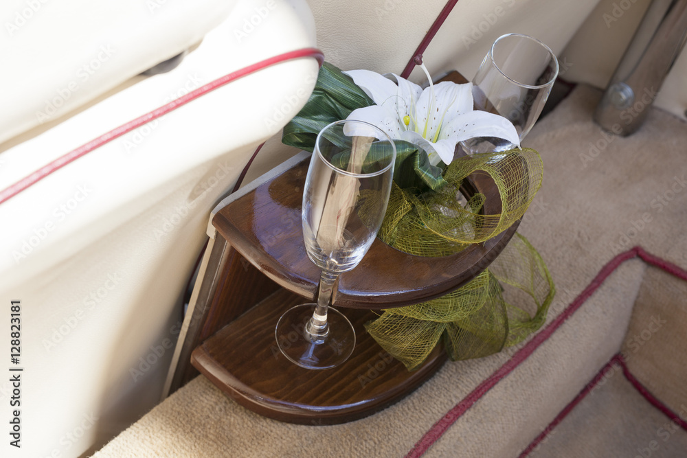 Two champagne glasses ready to use in the wedding car Stock Photo