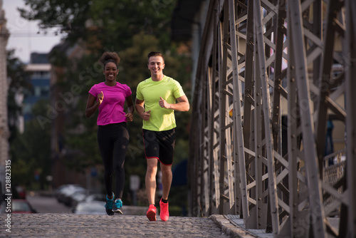 multiethnic couple jogging in the city © .shock
