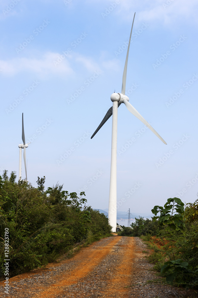 Wind turbine against mountain