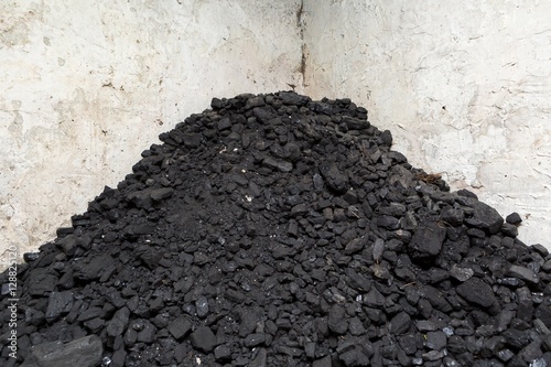 Fotografie, Obraz Black coal lying on a pile in house basement