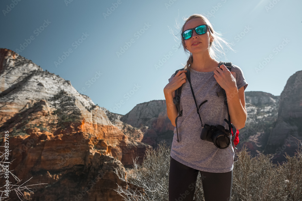 Tourist with camera standing in the Zion National Park, USA