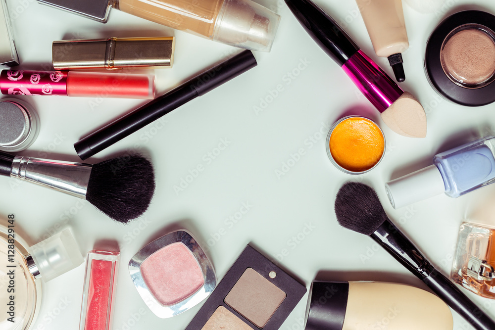 Brush and cosmetic isolated on a white background. Top view. Brush and cosmetic isolated on a white background. Top view.