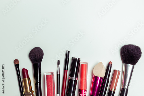 Brush and cosmetic isolated on a white background. Top view.