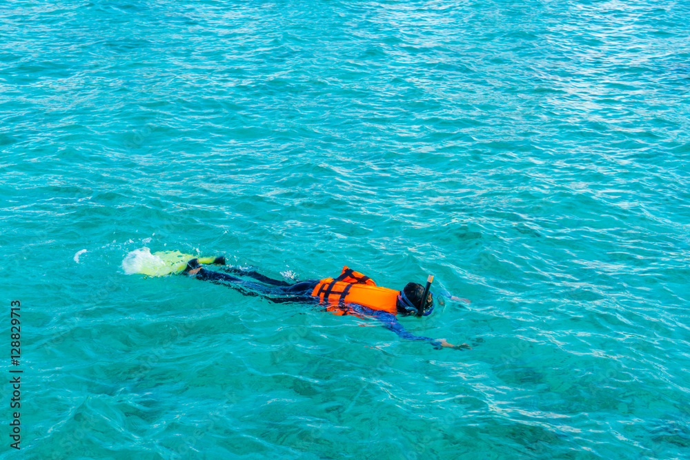 Snorkeling in tropical Maldives island .