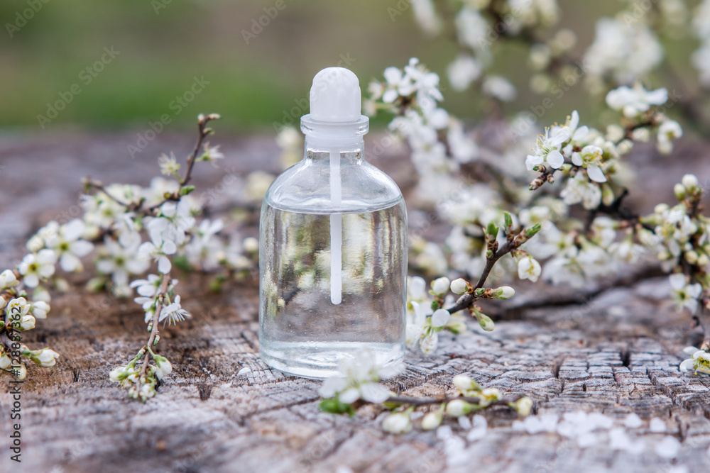 Spa and wellness setting with sea salt, oil essence, flowers and Spa and wellness setting with sea salt, oil essence, flowers and