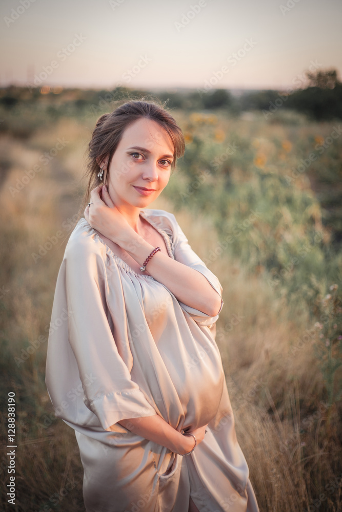 Portrait of a young beautiful pregnant woman on nature. Portrait of a young beautiful pregnant woman on nature.