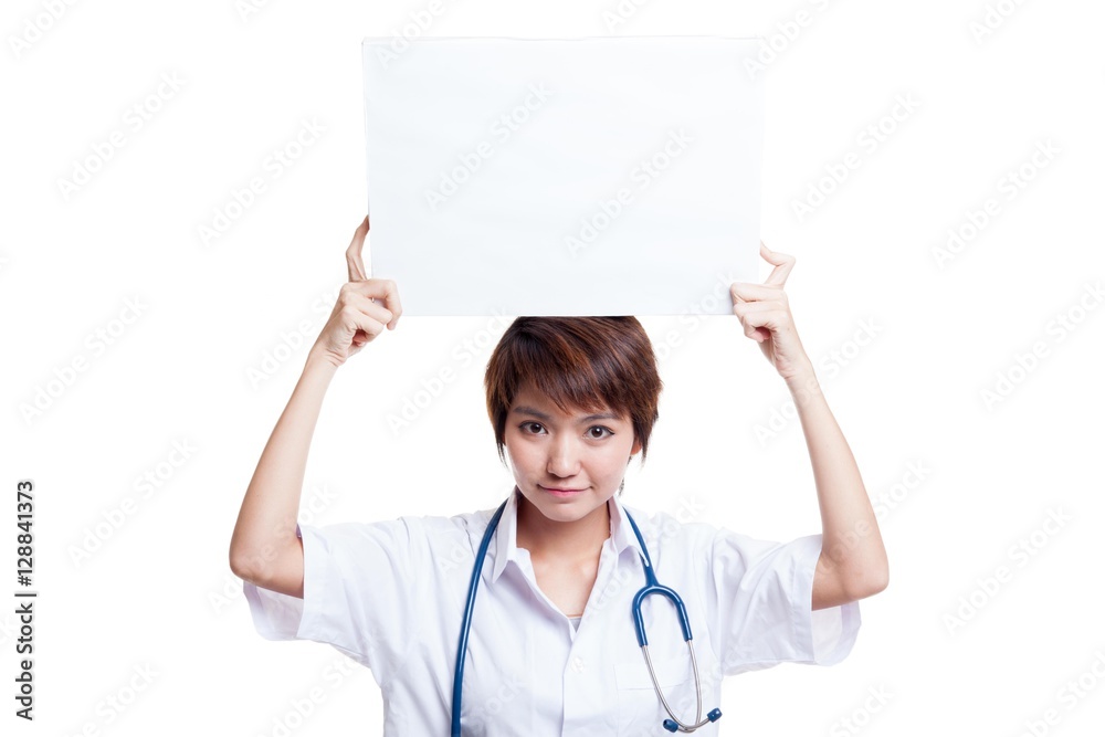 Young Asian female doctor show a blank sign over head. Young Asian female doctor show a blank sign over head.