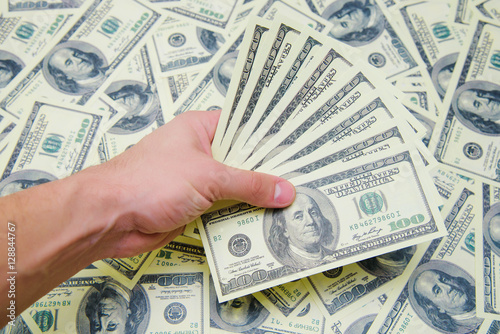 Money in the man's hands isolated on white background.