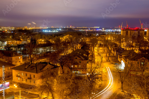 Voronezh cityscape view from rooftop. Two-storey houses, night lights. 