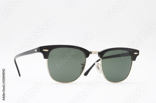Retro black sunglasses side view . Isolated on a white backgroun