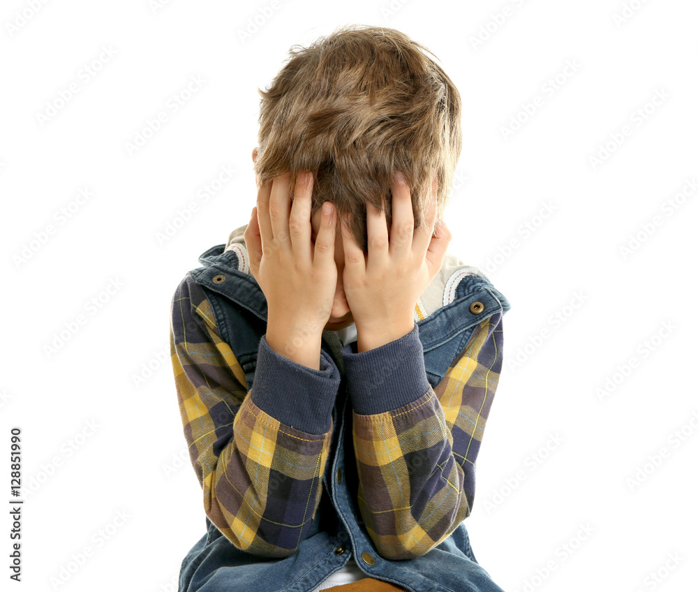 Little upset boy covering face with hands, isolated on white Little upset boy covering face with hands, isolated on white