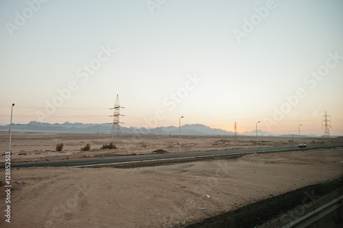 Road with sand and hill on evening Egypt