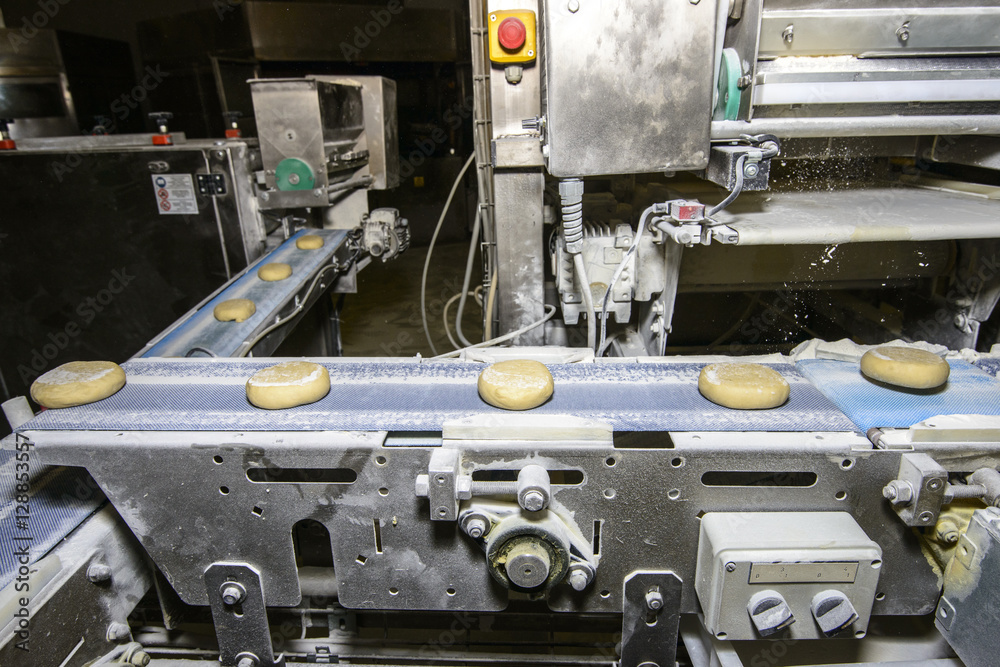 Bread dough running on conveyor belt