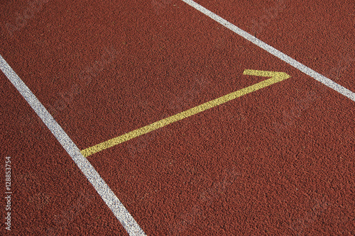 Athletics stadium running track white lines marks.