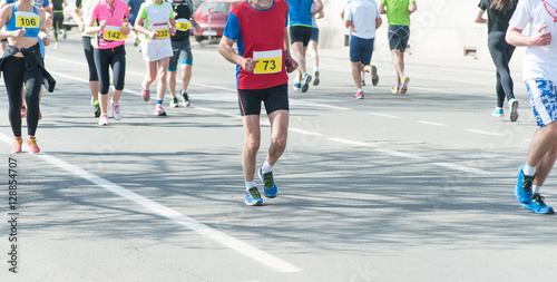 Marathon, street runners in spring day