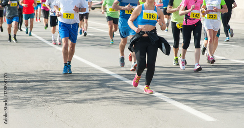 Marathon, street runners in spring day