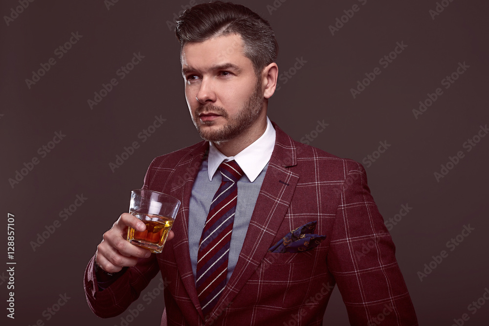 Portrait of elegant brutal man in a expensive suit Portrait of elegant brutal man in a expensive suit