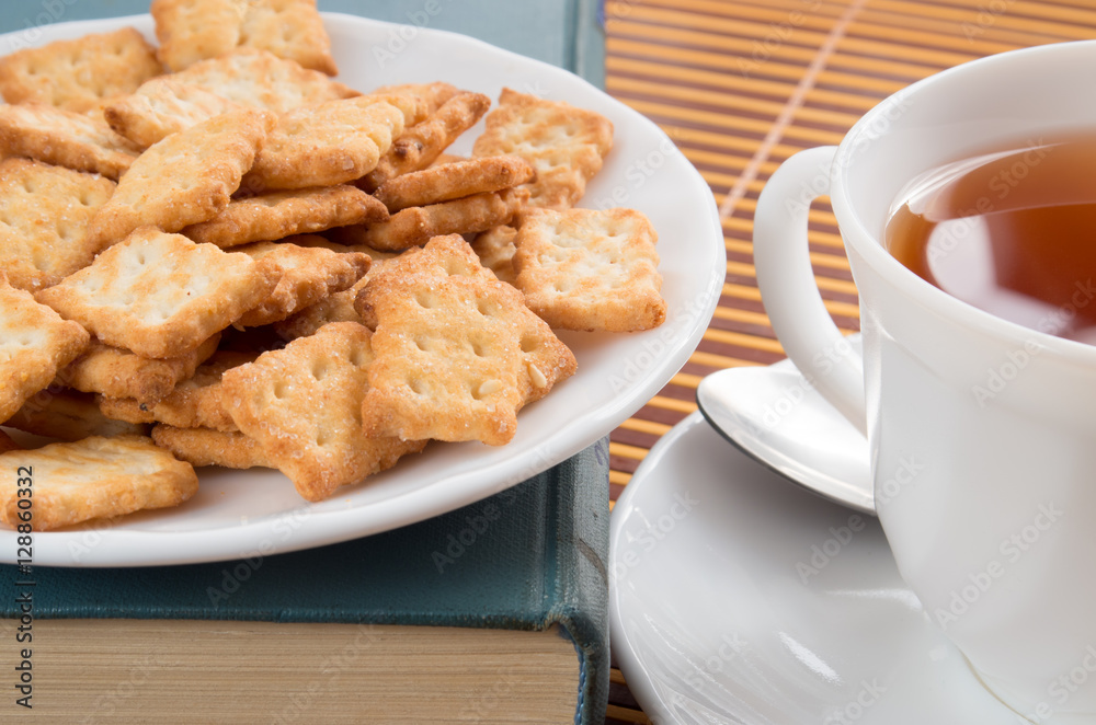 Cup of tea and a plate of crackers close-up Cup of tea and a plate of crackers close-up