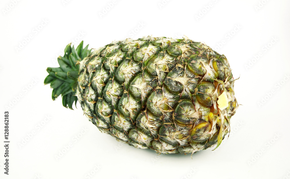 Ripe pineapple with slices isolated on white background Ripe pineapple with slices isolated on white background