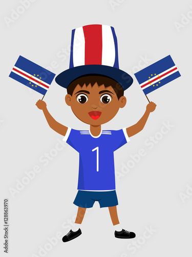 Fan of Cape Verde national football team, sports. Boy with flag in the colors of the state command with sports paraphernalia. Kid with national flag.