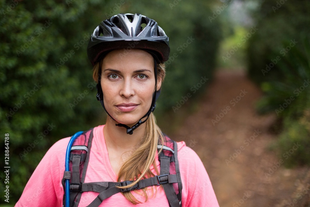 Female athletic wearing bicycle helmet Female athletic wearing bicycle helmet