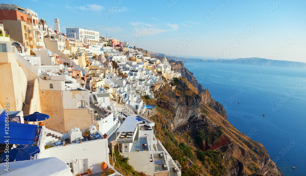 Cityscape panorama of Fira town, Santorini in the late afternoon