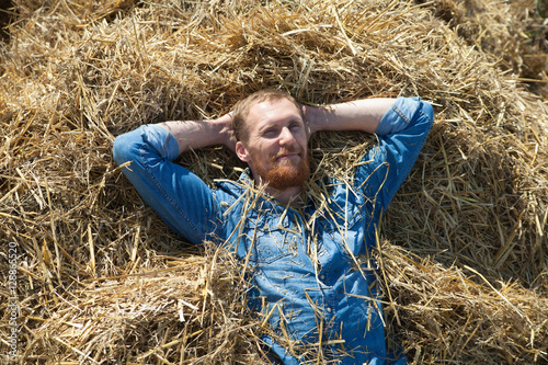  man in jeans on   hay © DariaTrofimova