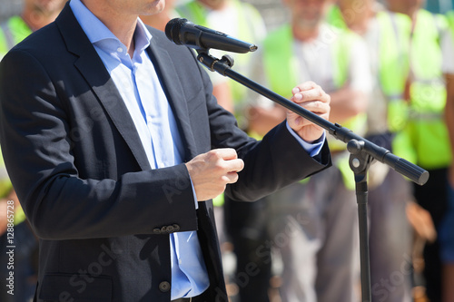 Businessman or politician is giving a speech photo