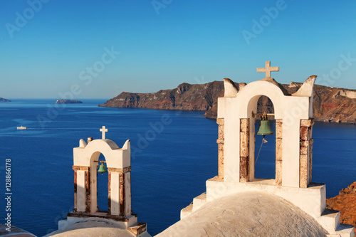 Two churches in Oia, Santorini. Detail on crosses and bells