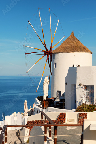 Windmill in Oia town, Santorini, Greece. Vertical shot